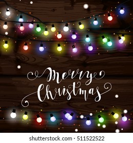 Christmas lights poster with shining and glowing garlands. Merry Christmas lettering. Christmas background