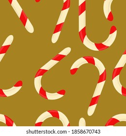 Christmas lollipops on a brown background. Seamless pattern with Christmas candies.