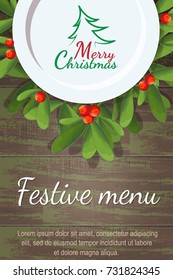 Christmas menu for restaurant or cafe. Blank plate is on a wooden table on the branches of mistletoe. Merry Christmas. tree.