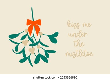 Christmas mistletoe with a bow and a quote Kiss me under the Mistletoe. Hanging  green plant with berries as a traditional symbol for Christmas. Vector drawing in a simple cartoon style. Isolated