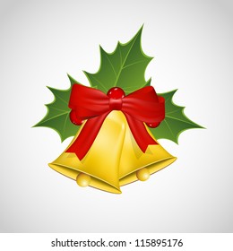 Christmas mistletoe and golden bells width a bow.