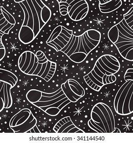 Christmas mittens and socks chalk doodles vector seamless pattern 