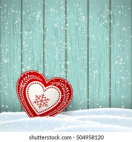 Christmas motive in scandinavian style, red and white decorated heart in front of blue wooden wall and snow, vector illustration, eps 10 with transparency and gradient meshes