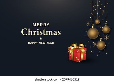 Antecedentes de Navidad y Año Nuevo. Caja de regalo roja con cinta dorada. Bolas de oro colgando de la cinta.