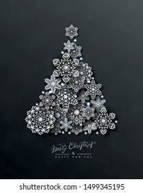 Christmas and New Year card with silhouette of Christmas tree made of 3d silver openwork snowflakes on black background. Holiday Vector Design