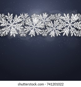 Christmas and new year dark blue background with christmas silver glittering snowflakes on dark background. Merry Christmas greeting card.