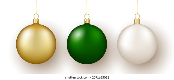 Christmas and New Year decor. Set of gold, white and green glass balls on ribbon with bow. 