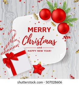 Christmas or New Year decoration background. Vector illustration. Top view on Xmas composition with gift box, golden confetti and red balls. Festive backdrop with greeting card and on wooden texture.