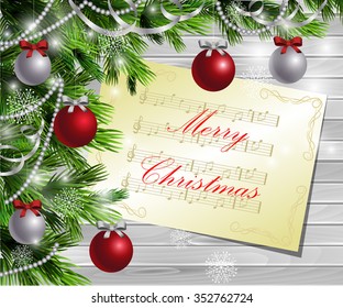 Christmas  New Year design light wooden background with christmas tree and silver and red balls and music