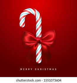 Christmas or New Year greeting card. Realistic candy cane with red bow and ribbon on red background. Vector illustration.