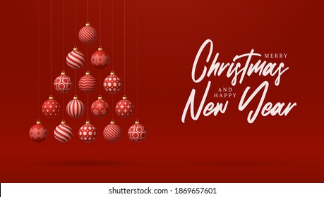 Christmas and new year greeting card. Creative Xmas tree made by shiny red balls on red background for Christmas and New.