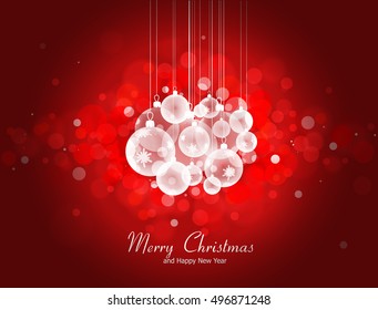 Christmas and New Year greeting card with Christmas balls on bokeh background