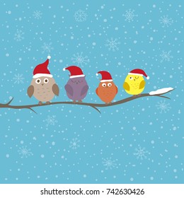 Christmas or New Year illustration. Funny owls in Santa hats on the branch. Can be used for celebration card, invitation, scrapbooking.