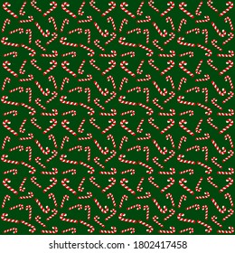 Navidad y patrón de año nuevo. caramelos blancos y rojos con fondo verde