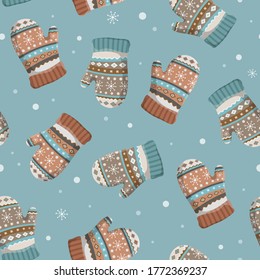 Christmas and New Year seamless pattern with winter gloves and mittens. Great for fabric, textile, wallpaper, giftwrap, srcapbook etc. Vector background. Muted colors.
