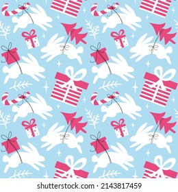 Christmas and new year seamless pattern with rabbits and gift boxes.