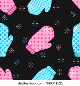 Christmas and New Year seamless pattern with winter knitted mittens and snowflakes on the black background.