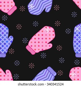 Christmas and New Year seamless pattern with winter knitted mittens and snowflakes on the black background.