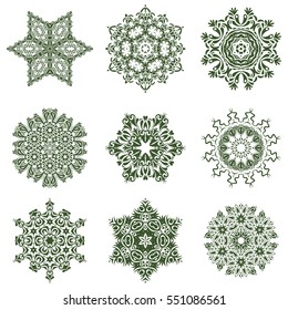 Christmas and New Year theme. Snowflakes decorated with circles and dots. Vector winter design on white background. Green snowflakes set.