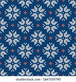 Christmas and New Year traditional knitted seamless pattern with snowflakes. Norwegian style sweater. Wool texture. Vector illustration. Holiday background.