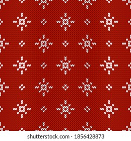 Christmas and New Year traditional knitted seamless pattern with snowflakes. Norwegian style sweater. Wool texture. Vector illustration. Holiday background.