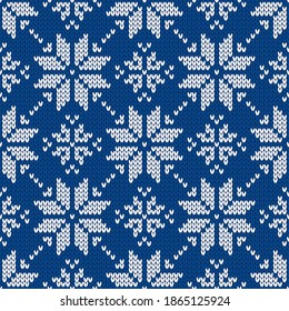 Christmas and New Year traditional knitted seamless pattern with snowflakes. Norwegian style sweater. Wool texture. Vector illustration. Holiday background.