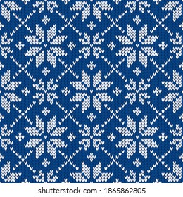 Christmas and New Year traditional knitted seamless pattern with snowflakes. Norwegian style sweater. Wool texture. Vector illustration. Holiday background.
