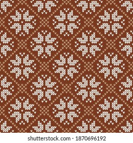 Christmas and New Year traditional knitted seamless pattern. Norwegian style sweater. Wool pattern. Vector illustration with snowflakes. Holiday background.