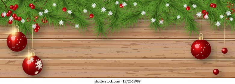 Christmas and New Year vector banner template. Fir tree branches border with winter decor on wooden background