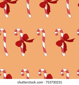Christmas New Year winter candy canes with bow seamless pattern