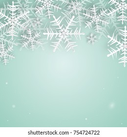 Christmas and New Years background Made of paper snowflakes and diamonds. Snowflakes on a blue background