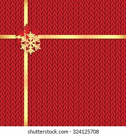 Christmas and New Year's background with place for your text.Gold  snowflakes  on a red knitted background