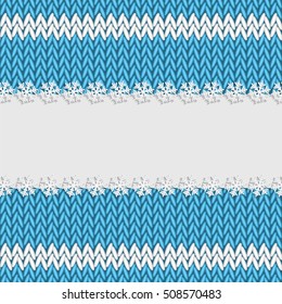 Christmas and New Year's background with place for your text.White snowflakes on a blue knitted backgrounds