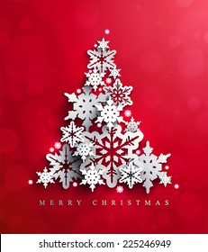 Christmas and New Years red background with  Christmas Tree made of cutout paper snowflakes. 