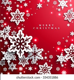 Christmas and New Years red background with paper snowflakes 