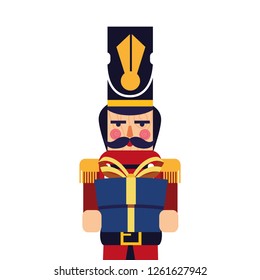 christmas nutcracker holding gift box