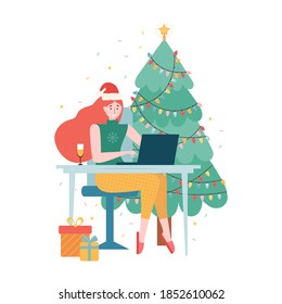 Christmas Online internet party. New year celebration in quarantine mode. Girl in a Santa hat and a glass of champagne is sitting with a laptop near the Christmas tree. Holiday event remotely at home