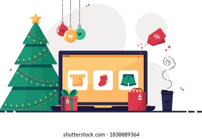 Christmas online shopping with laptop. Christmas tree, gift boxes, present and decorations. Winter sale eshop. Xmas. Ordering gifts at home. Clothes store. Colorful. Esp 10