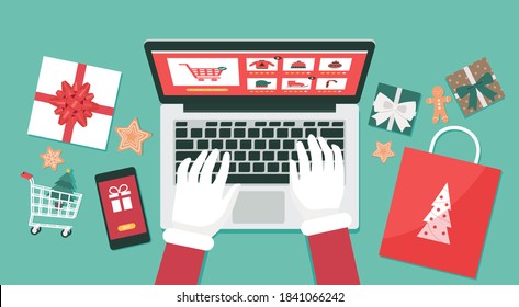 Christmas online shopping top view concept, santa Claus hand makes order on laptop screen with gift boxes and shopping bags, winter holidays sales, flat lay vector illustration