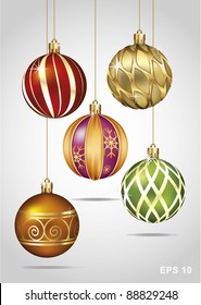 Christmas Ornaments Hanging on Gold Thread