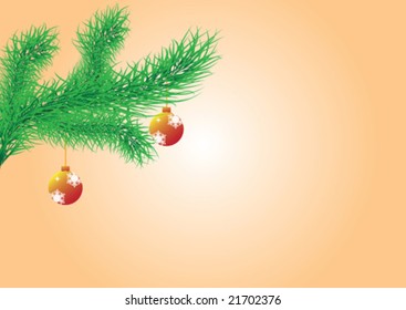 Christmas ornaments hanging on a pine branch