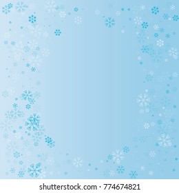 Christmas oval border or frame with random scatter falling blue snowflakes on a blue background.