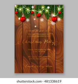 Christmas party invitation with holiday wreath of needle fir tree light garland, red balls on wooden background 