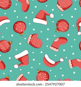 Patrón de Navidades con bolas, mitones, medias y sombrero de Santa Claus sobre un fondo azul. Concepto de la Navidad para la decoración, saludos