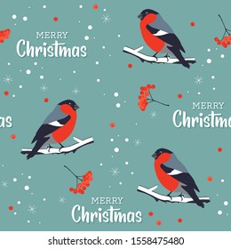 Christmas pattern with bullfinches. Seamless pattern with birds, snow, and rowan berries.