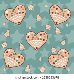 Christmas pattern with cookies on the blue background with stars