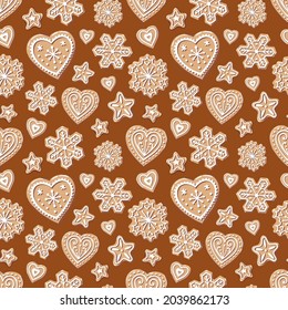Christmas pattern with gingerbread. Snowflake, heart, star on a brown background. Sweet and tasty festive cookies