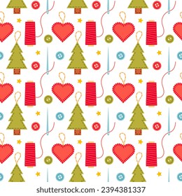 Christmas pattern of handmade felt toys and buttons. Pattern of felt Christmas tree decorations, handmade heart, needles with red string on white background.