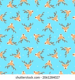 Christmas pattern with heads of reindeers on a blue background. Vector illustration 