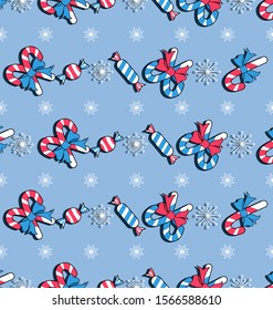 Christmas pattern. Holiday sweets and snowflakes. Winter festive background. Seamless template with candies, striped lollipops and decorative snowflakes on light blue background. 